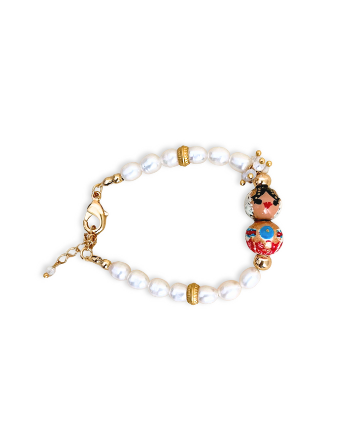 Pulsera Perlada Empollerada turquesa, motita roja.